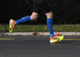 Runner landing on the heel mid-stride, the moment heel and tendon pain tends to flare